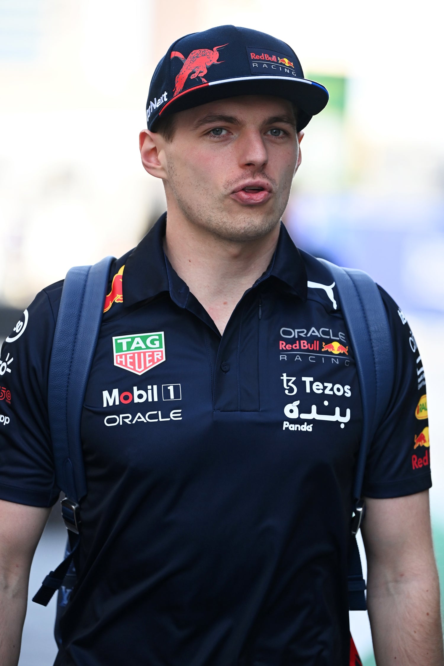 man wearing black F1 teamwear
